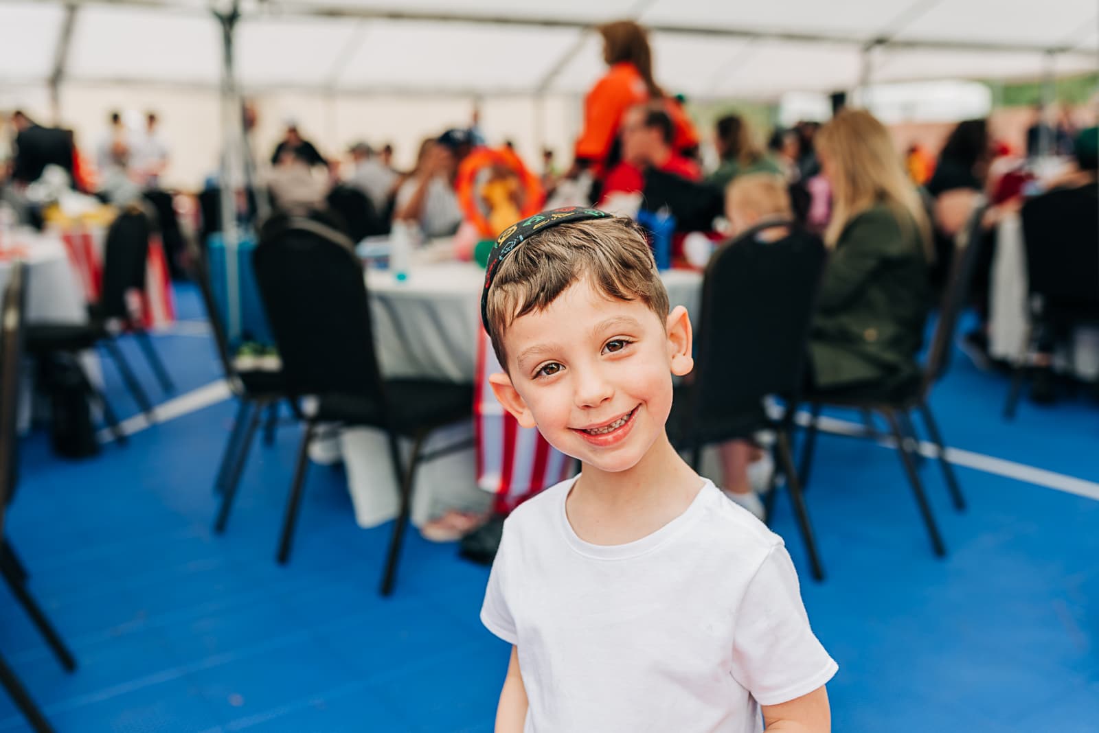 A young member of the kehilla at a shul celebration
