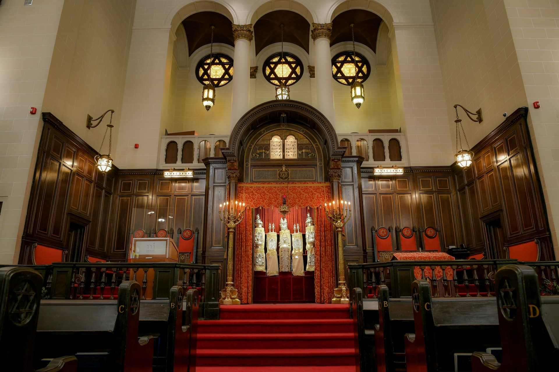 Warm light filling a synagogue sanctuary
