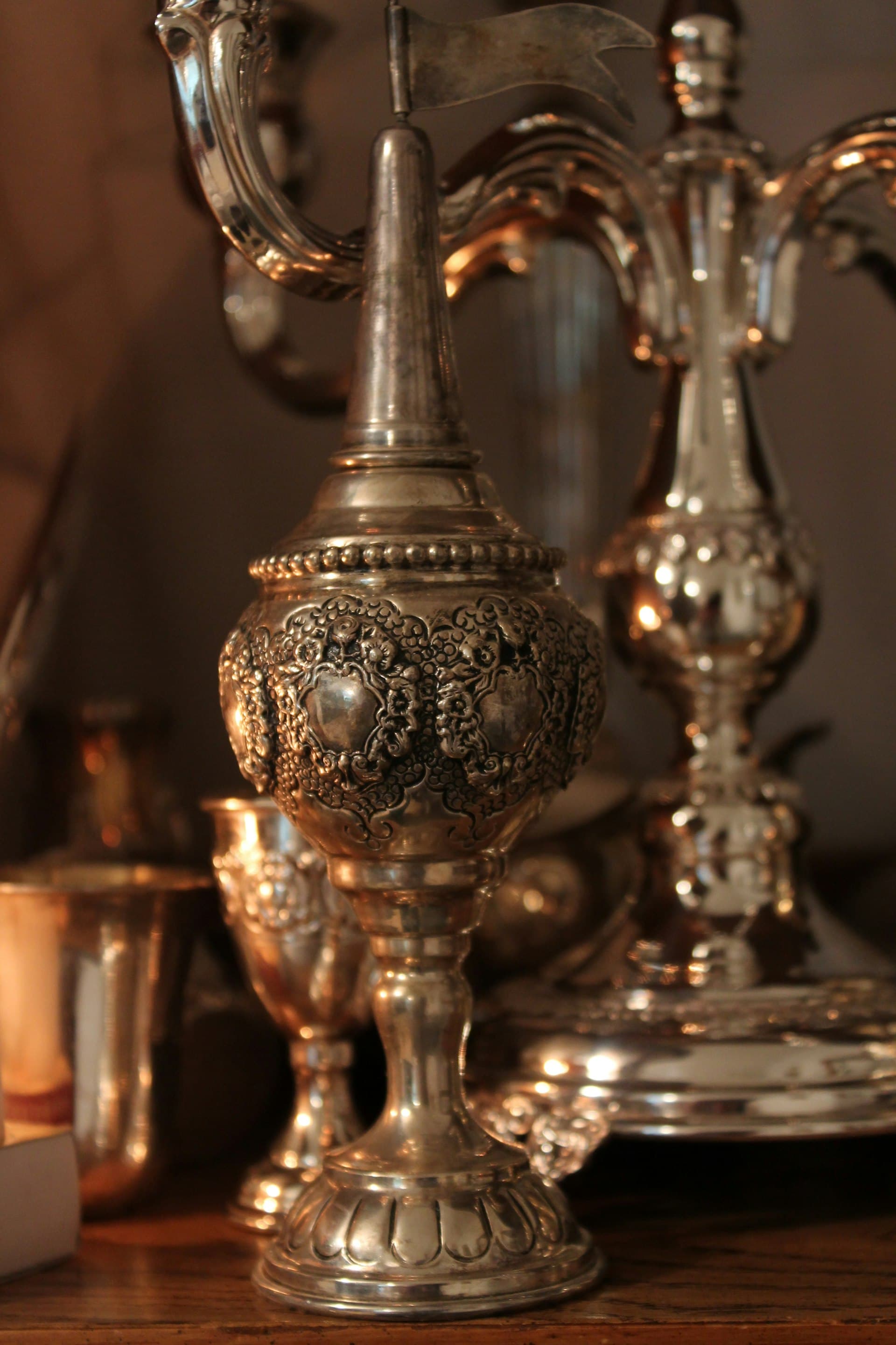 A silver candelabra on a Shabbat table