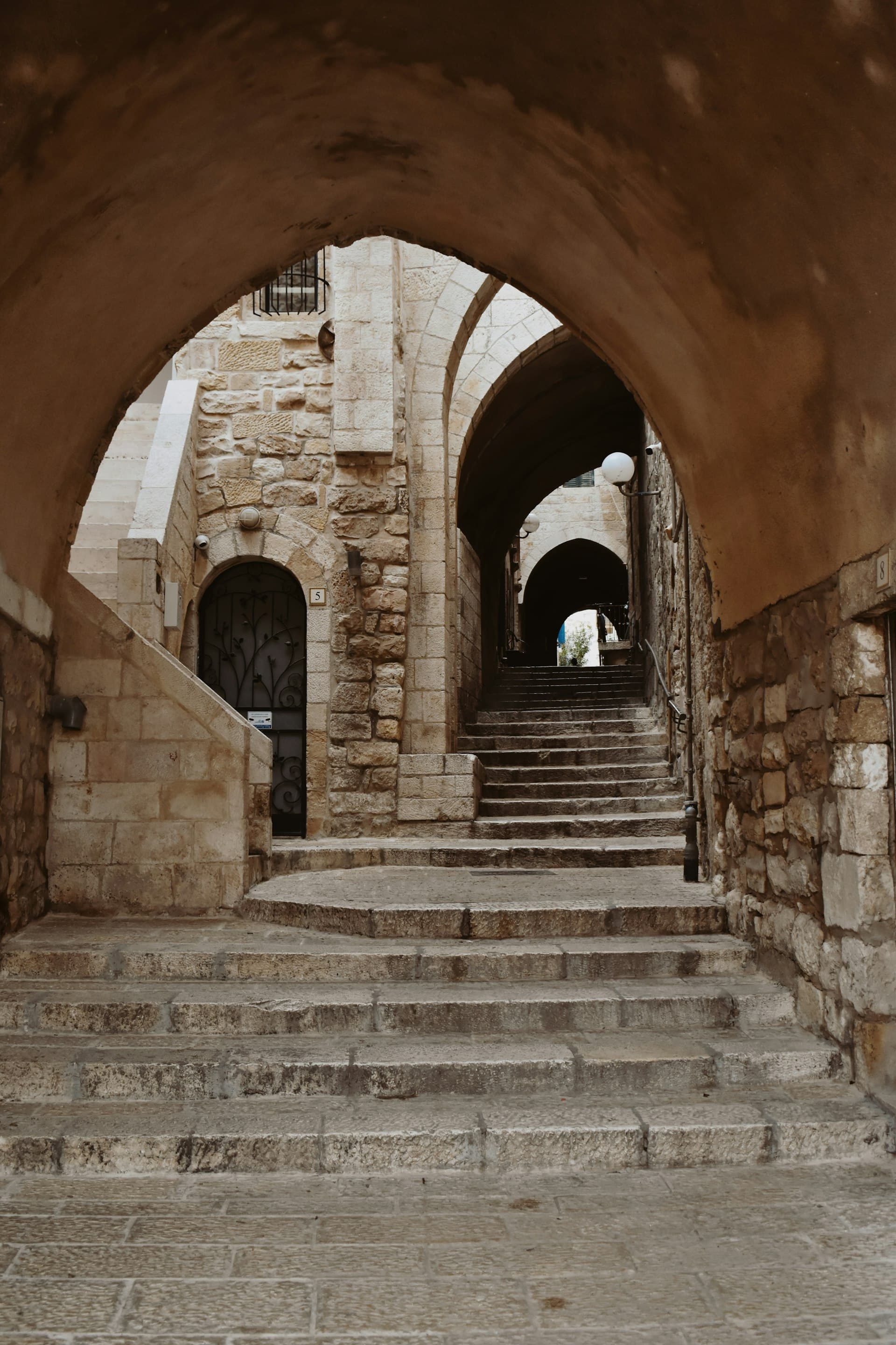 Sunlit stone steps leading to a doorway